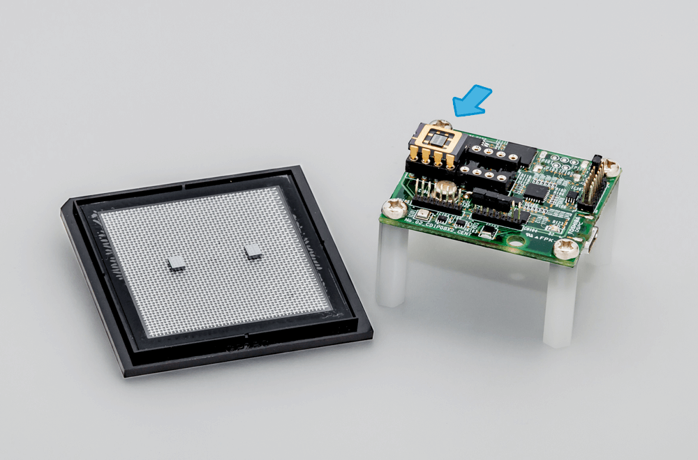 The newly developed chip, alone (left) and installed on a hydrogen sensor (right; location of chip indicated with arrow)