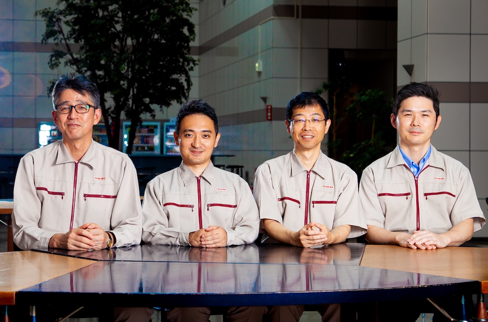 From left to right: Akira Ushijima, Masahiro Saito, Yasunori Chiba and Hiromasa Takahashi, members of the spot welding inspection robot development team of the Mechatronics Engineering Solution Department, Corporate Manufacturing Engineering Center, Toshiba Corporation.